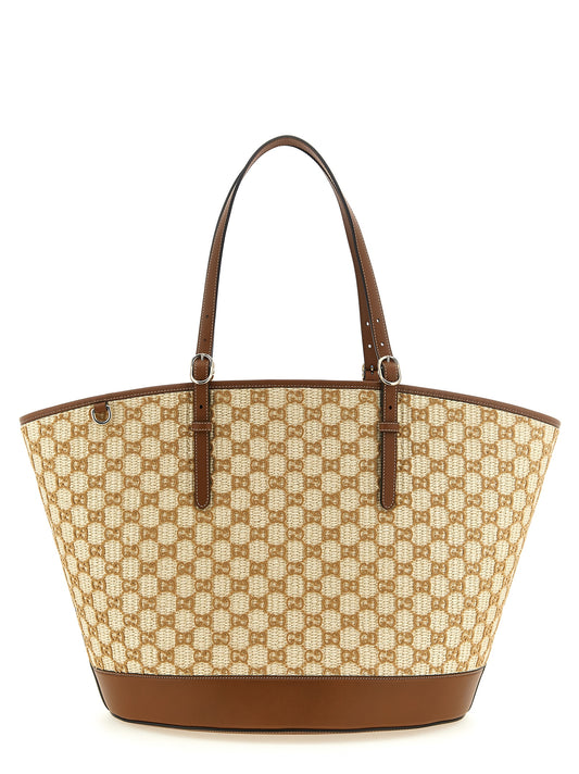 This Shopper Handbag by Gucci for women in cotton & leather and brown & patterned presents a sculptural silhouette featuring a secure zipper & magnetic, ample , and versatile adjustable-strap & handle for a sculptural finish.