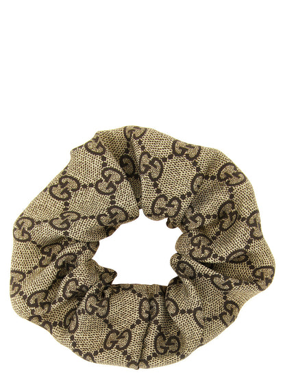 Ponytail Holder by Gucci for women in silk cashmere & sequins beige, brown, multicolor, red, white, patterned & monogram features an ornamental design, artfully capturing the ornamental essence of the Gg Silk Ponytail Holder collection with a sophisticated and premium finish.