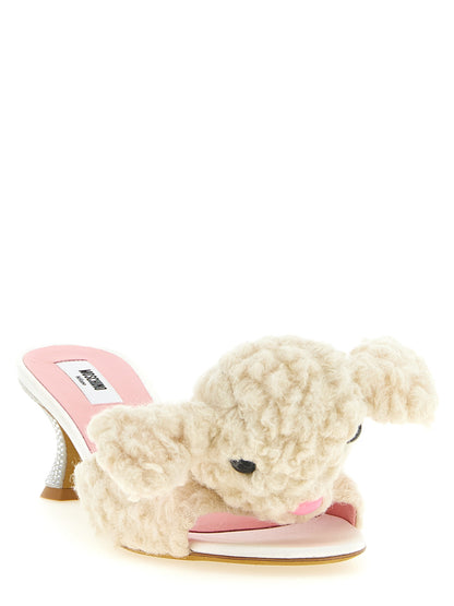 Mules Sandals Flat Shoes by Moschino for women in sheep leather & virgin wool cream, pink & white showcases a dynamic silhouette, artfully capturing Women's Sheep Leather & Virgin Wool Mules Sandals Flat Shoes through its distinctive and elegant .