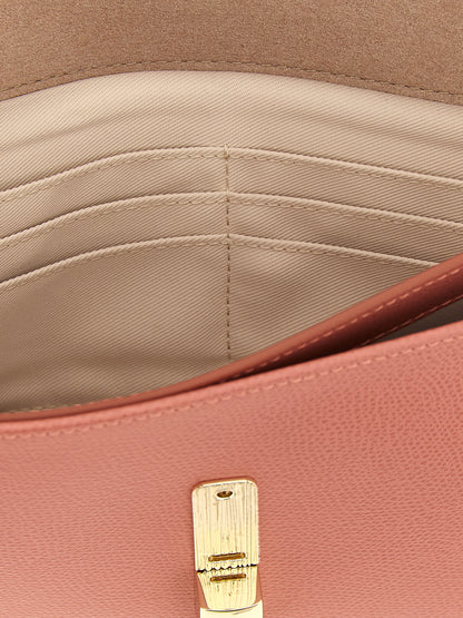 Clutch Handbag by Furla for women in calfskin leather coral, multicolor & pink showcases a sculptural silhouette, featuring a secure , ample built-in-compartments & cardholder, and versatile for a sculptural finish.