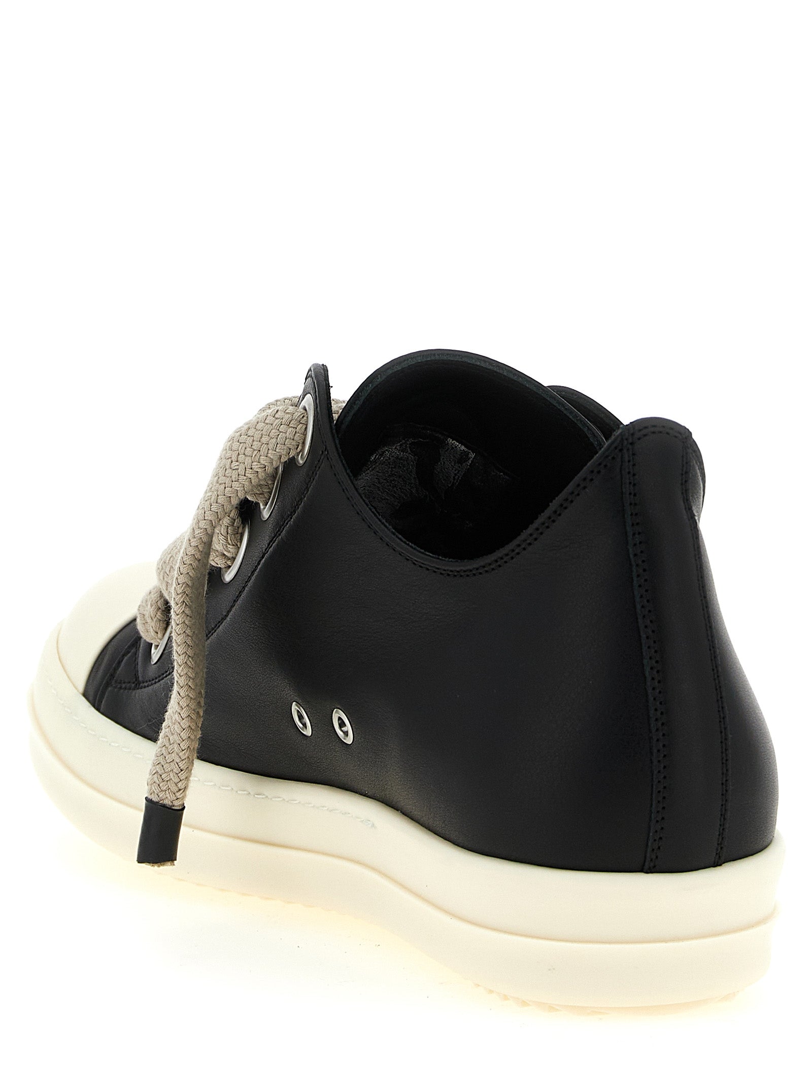 Sneakers by Rick Owens for women in bos taurus calfskin leather bicolour, black & white features an versatile design from the Women's Low Top Bos Taurus Calfskin Leather Sneakers collection, highlighting a versatile low-top style for a premium, high-fashion look.