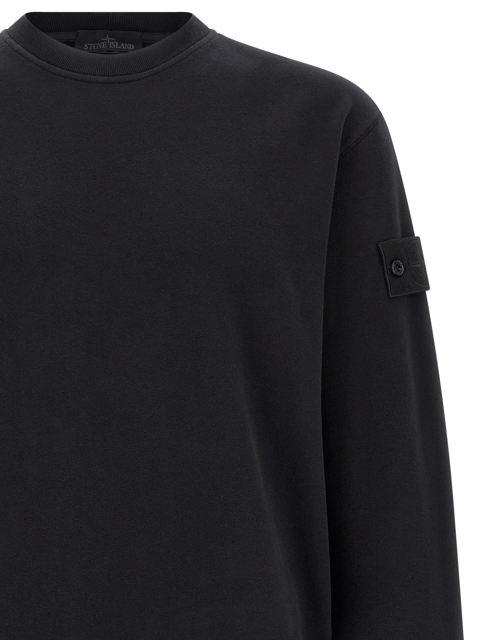 Sweatshirt by Stone Island for men in stretch organic cotton black features an exquisite silhouette, showcasing and crew neckline details for a exquisite look.