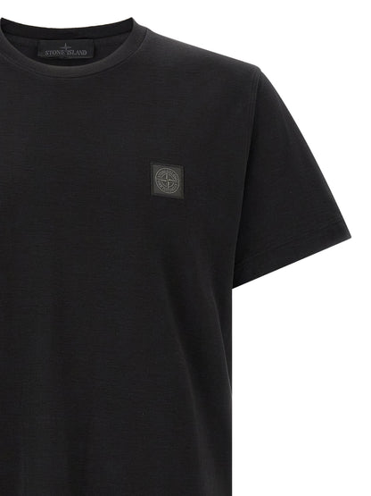 T-Shirt by Stone Island for men in organic cotton black showcases a fashionable silhouette, elegantly detailed with a fashionable and for a sophisticated, high-fashion look.