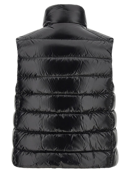 Vest by Moncler for women in polyamide black features a stylish silhouette, showcasing distinct pockets and a refined high-neck neckline for a truly stylish finish.