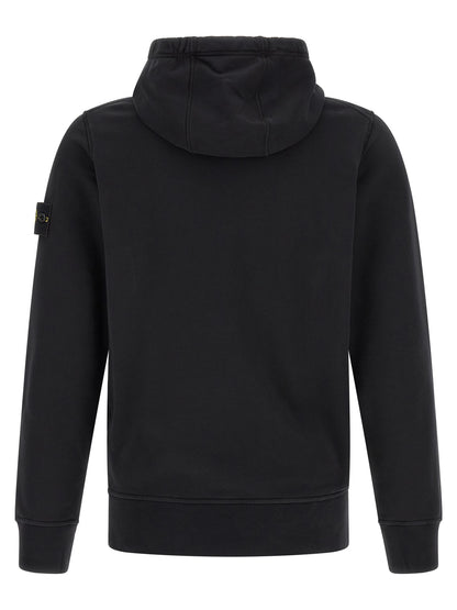Sweatshirt Hoodie by Stone Island for men in cotton black & signature features a slouchy chic silhouette, detailed with a slouchy chic and a signature hooded neckline for an elevated aesthetic.