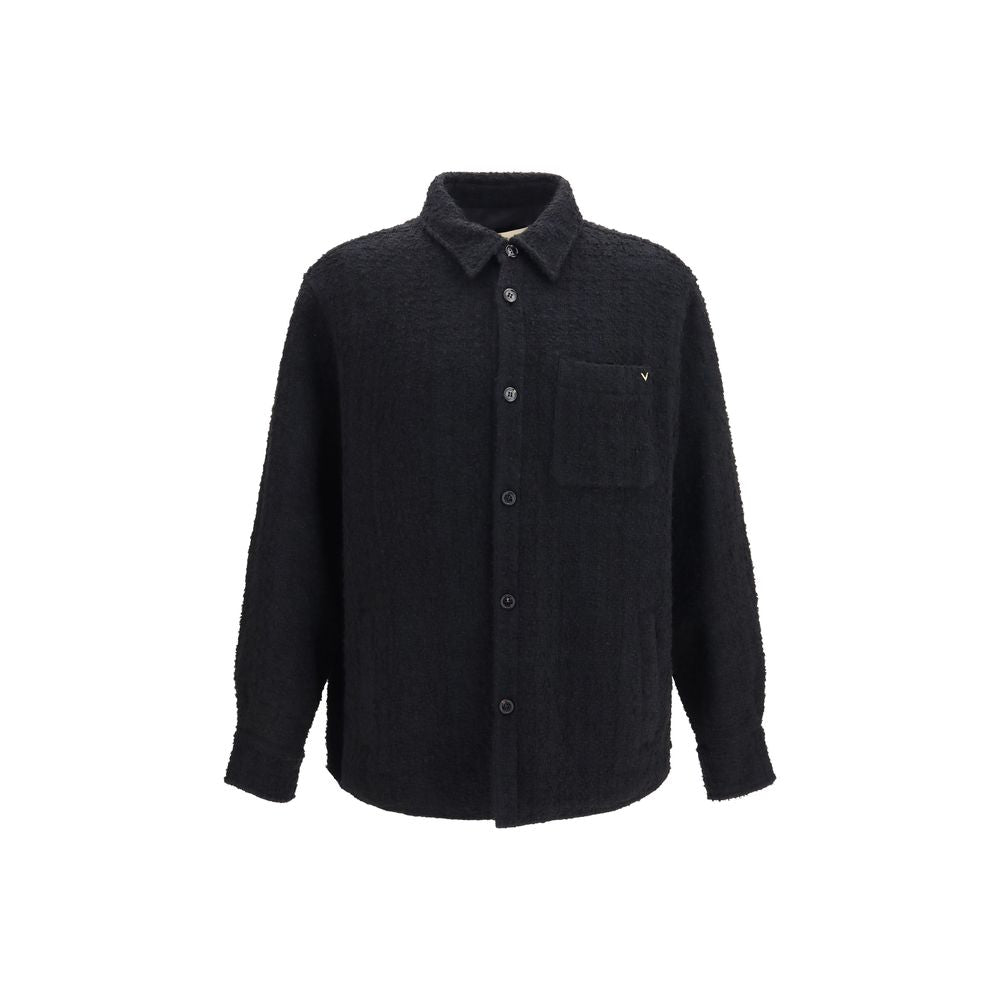 Overcoat by Valentino Garavani for men in polyamide polyester cotton & merino wool black features an voluminous silhouette, showcasing distinct pockets and a voluminous for a truly voluminous aesthetic.