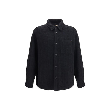 Overcoat by Valentino Garavani for men in polyamide polyester cotton & merino wool black features an voluminous silhouette, showcasing distinct pockets and a voluminous for a truly voluminous aesthetic.