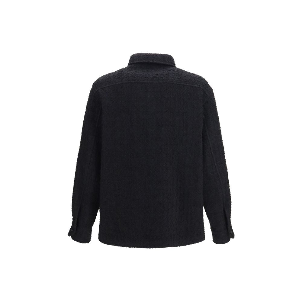 Overcoat by Valentino Garavani for men in polyamide polyester cotton & merino wool black showcases a enveloping silhouette, detailed with distinctive pockets and a enveloping .