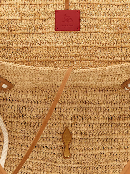 Large Shopper Tote Basket Bag by Christian Louboutin for women in polyurethane leather & rubber beige, brown, gold, white & signature features a jet-set Venus Polyurethane Leather & Rubber Large Shopper Tote Basket Bag design, complete with a secure , ample , and versatile handle for a jet-set look.