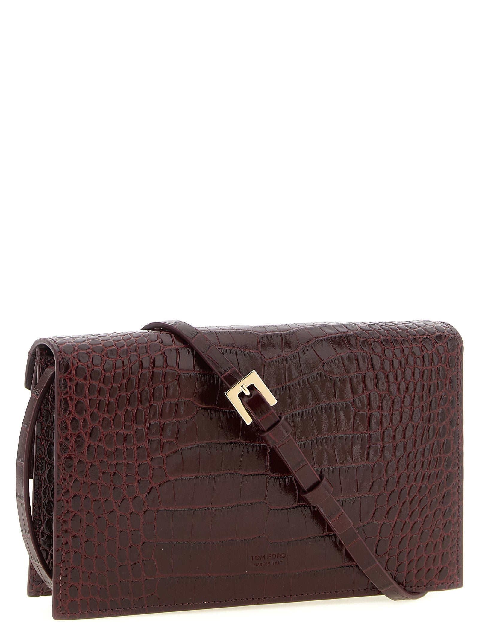 Mini Crossbody Clutch Handbag by Tom Ford for women in bio-acetate bordeaux, gold & print features a sculptural silhouette with a secure , organized built-in-compartments & cardholder, and versatile crossbody-strap & adjustable-strap for a sculptural finish.
