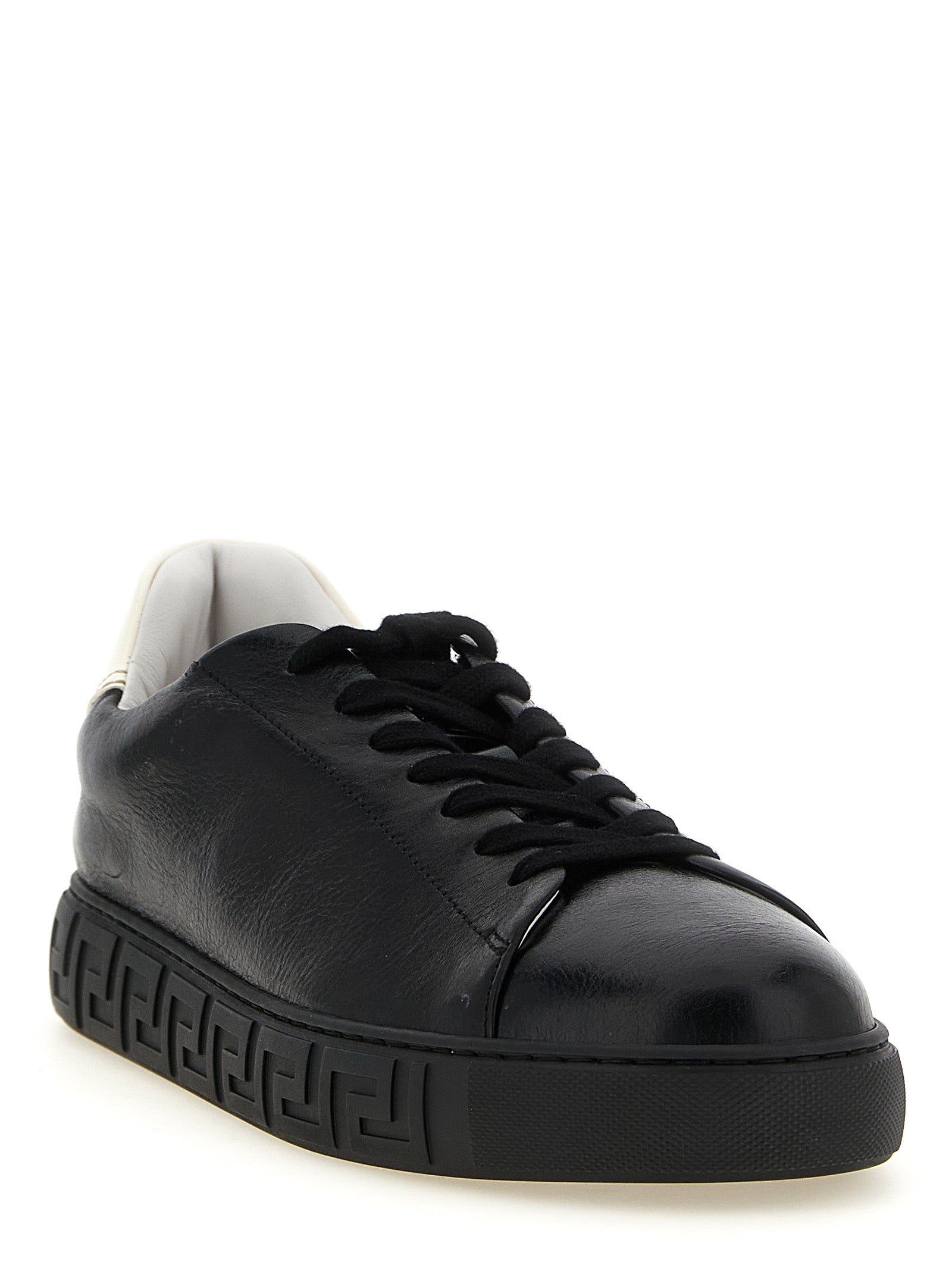 Sneakers by Versace for men in calfskin leather bicolour, black, gold, white, patterned & signature presents a sumptuous silhouette, artfully capturing the essence of the Play Men's Low Top Calfskin Leather Sneakers with its sumptuous low-top style design.