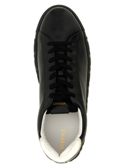 Sneakers by Versace for men in calfskin leather bicolour, black, gold, white, patterned & signature presents a sumptuous silhouette, artfully capturing the essence of the Play Men's Low Top Calfskin Leather Sneakers with its sumptuous low-top style design.