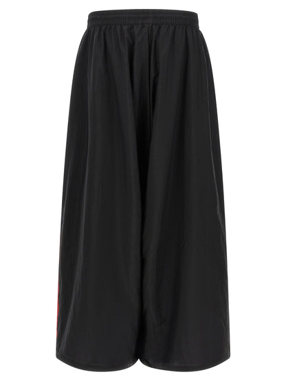 Activewear Pants by Y-3 for men in polyamide gradient, black, red & striped features an sporty athletic, relaxed-fit & wide with a long and , expertly finished with for an sporty performance aesthetic.