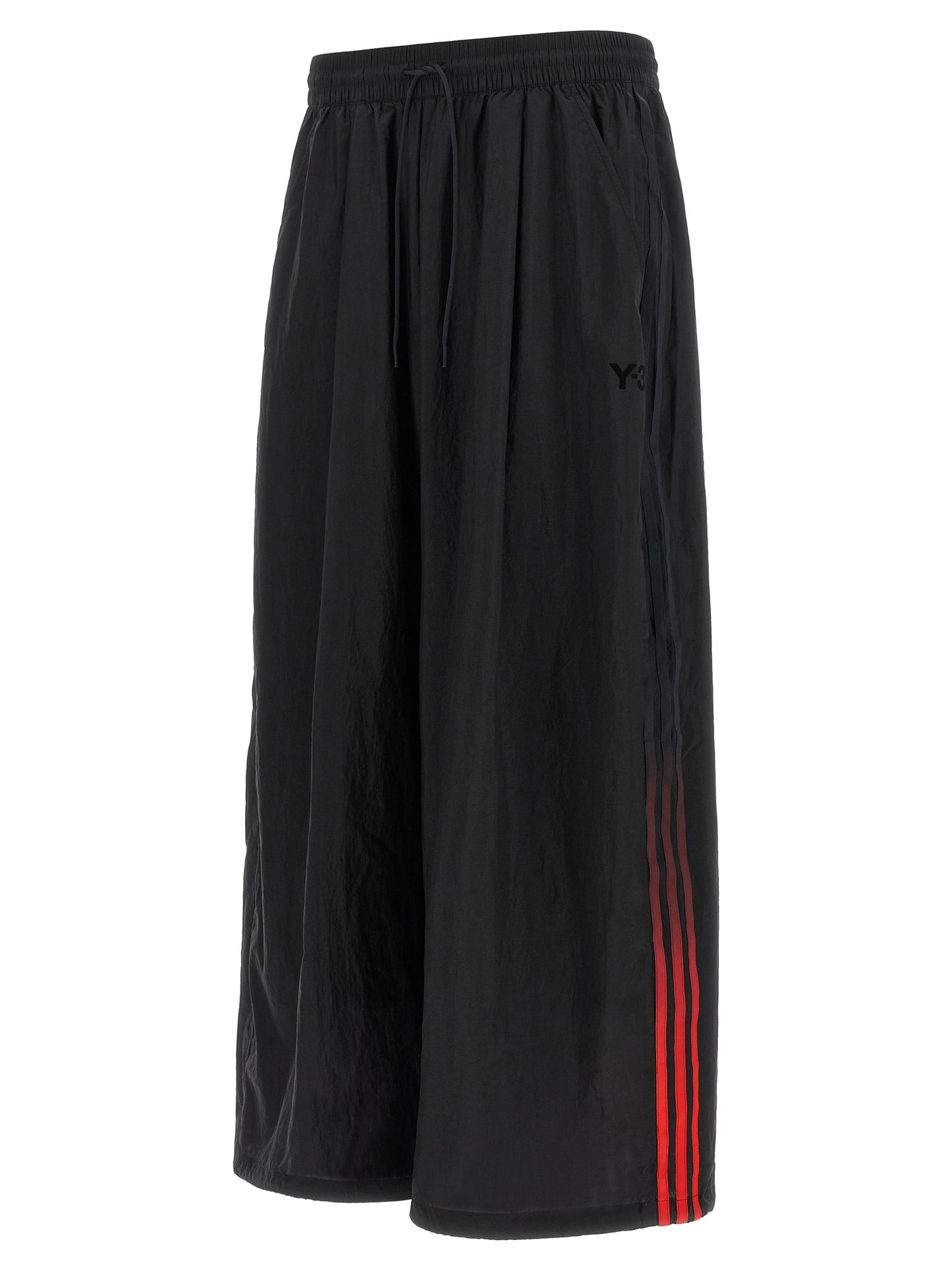 Activewear Pants by Y-3 for men in polyamide gradient, black, red & striped features an streamlined design with , highlighting a streamlined athletic, relaxed-fit & wide and long cut with a comfortable .