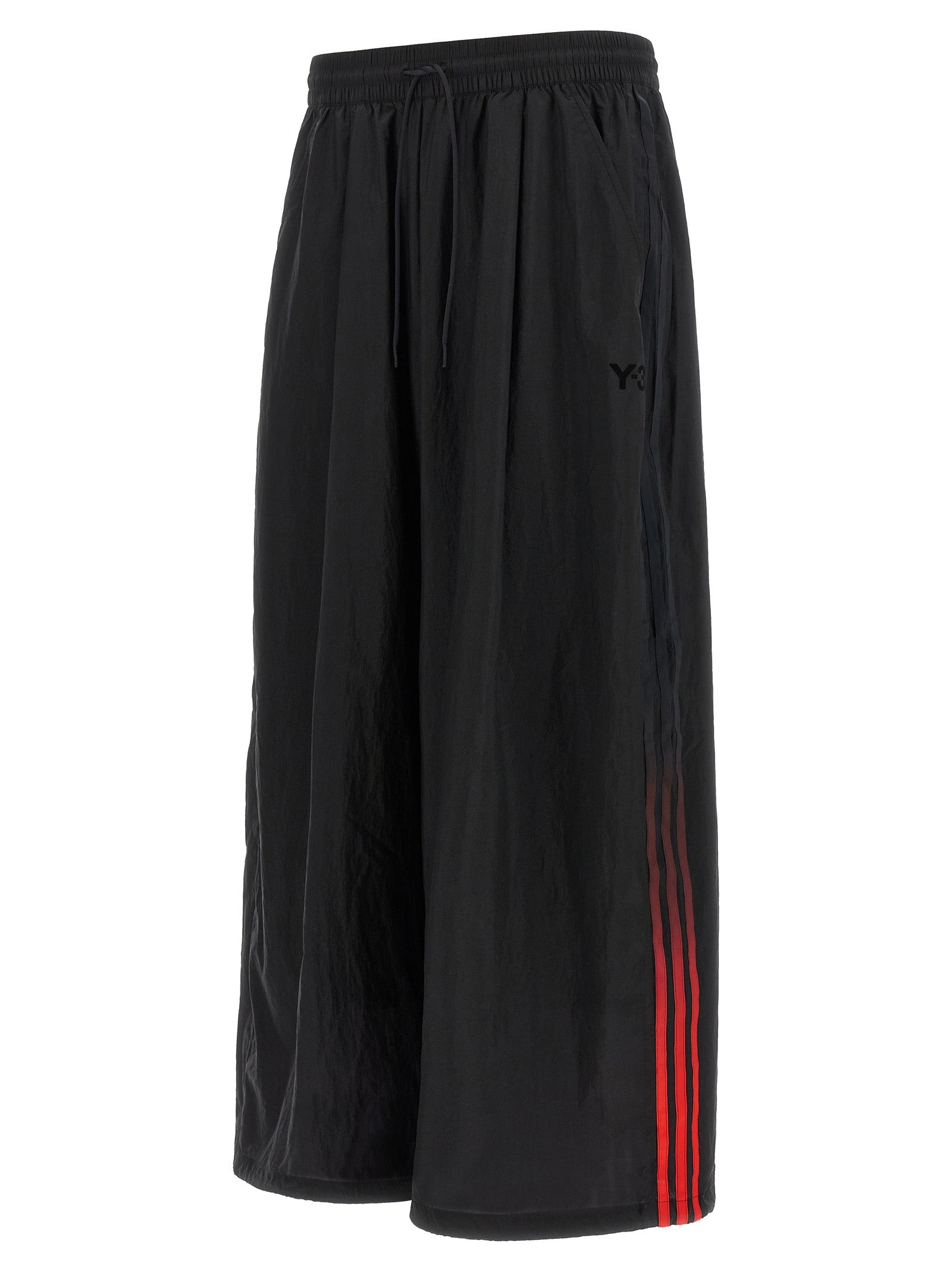 Activewear Pants by Y-3 for men in polyamide gradient, black, red & striped features an streamlined design with , highlighting a streamlined athletic, relaxed-fit & wide and long cut with a comfortable .