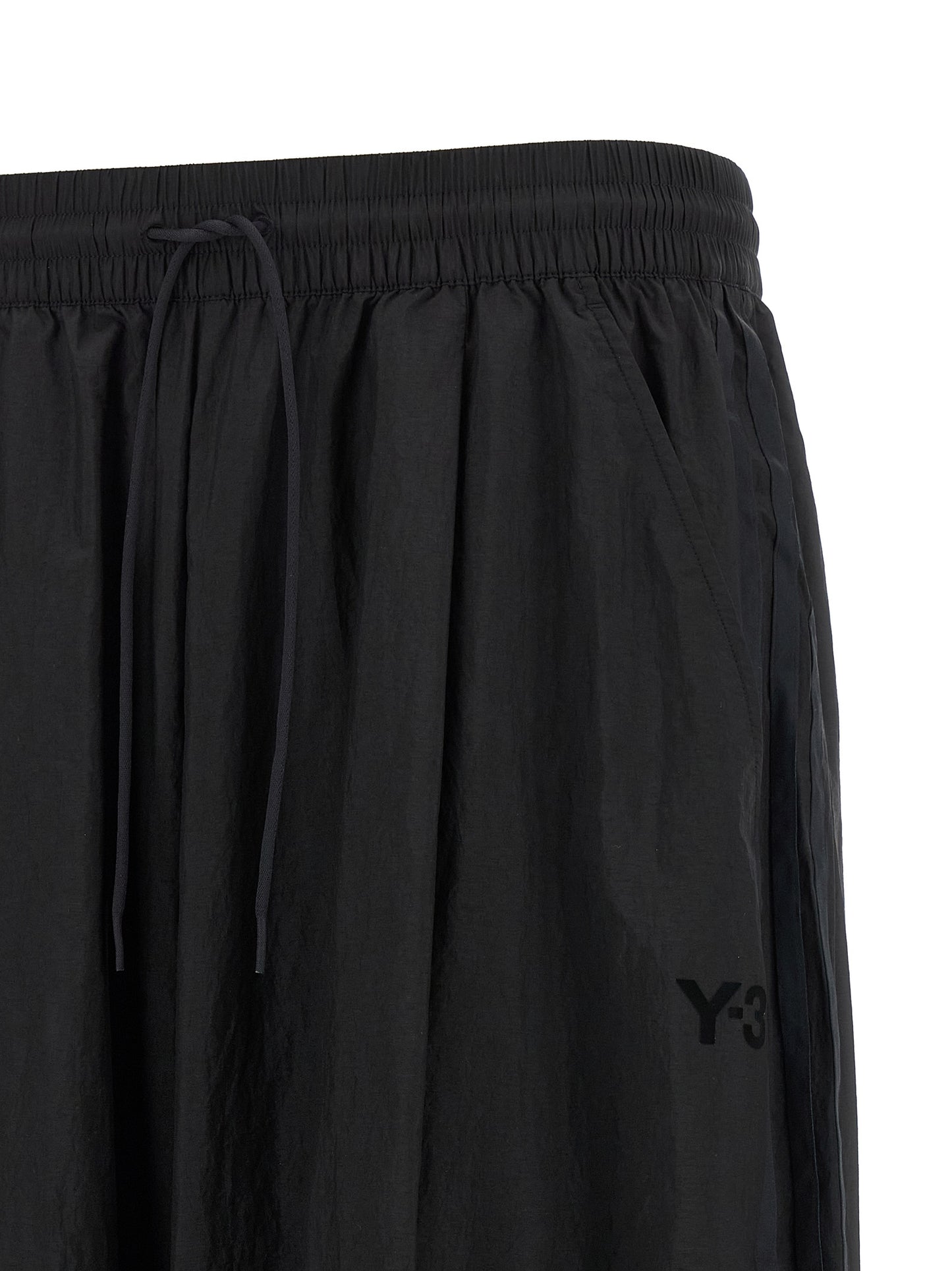 Activewear Pants by Y-3 for men in polyamide gradient, black, red & striped features an sporty athletic, relaxed-fit & wide with a long and , expertly finished with for an sporty performance aesthetic.