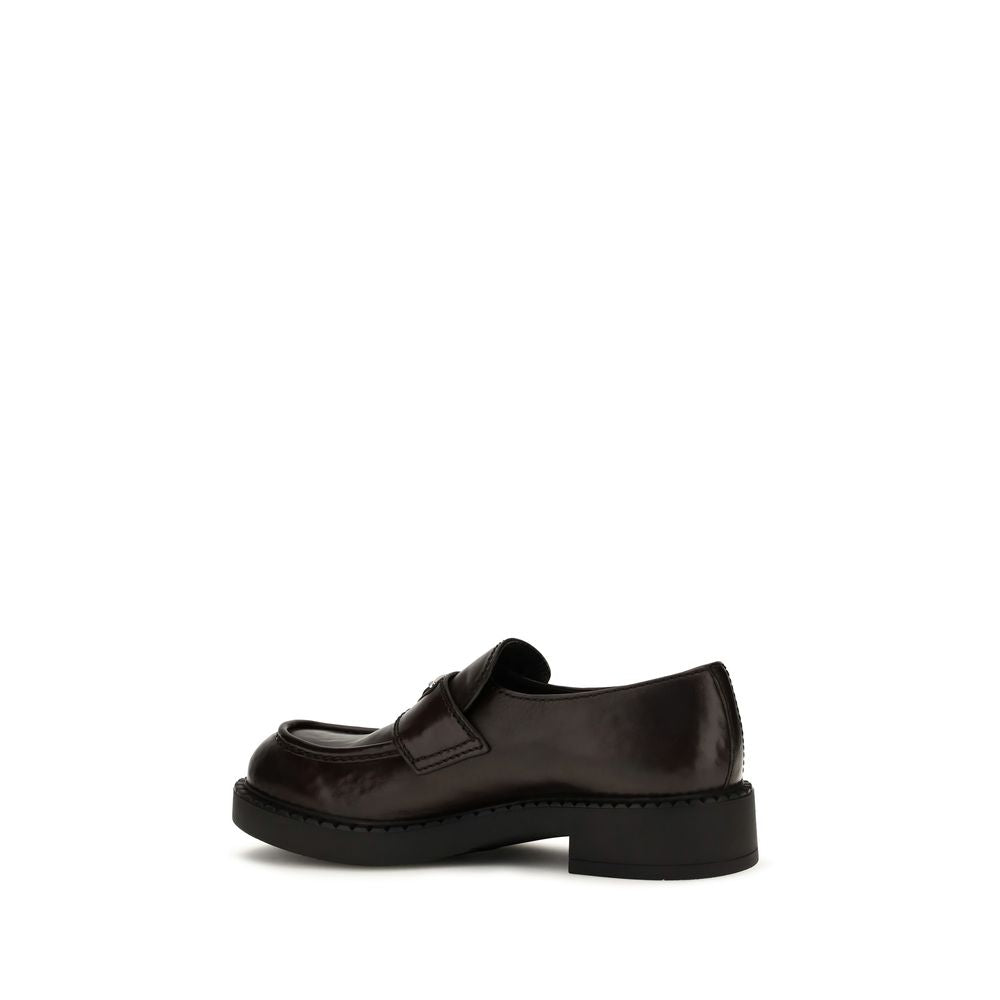 This Loafer Slip-On Strap Shoes by Prada for men in bos taurus calf leather brown features an exquisite silhouette from the Men's Bos Taurus Calf Leather Loafer Slip-On Strap Shoes collection, defined by a sophisticated and elegant .