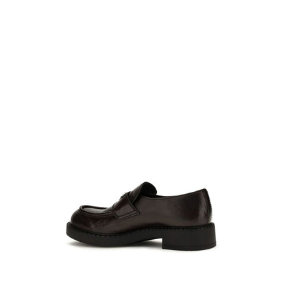 This Loafer Slip-On Strap Shoes by Prada for men in bos taurus calf leather brown features an exquisite silhouette from the Men's Bos Taurus Calf Leather Loafer Slip-On Strap Shoes collection, defined by a sophisticated and elegant .