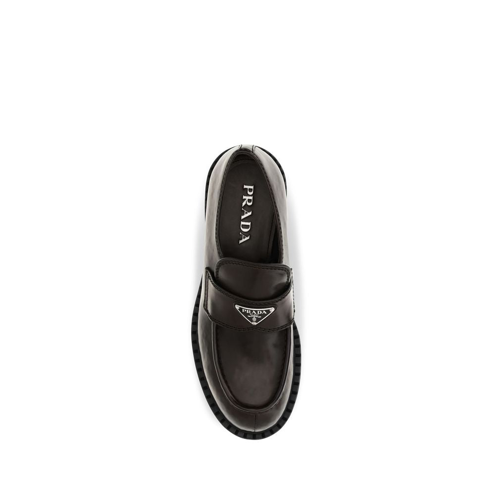 Loafer Slip-On Strap Shoes by Prada for men in bos taurus calf leather brown features an dynamic silhouette from the Men's Bos Taurus Calf Leather Loafer Slip-On Strap Shoes collection, defined by a dynamic and for a dynamic look.