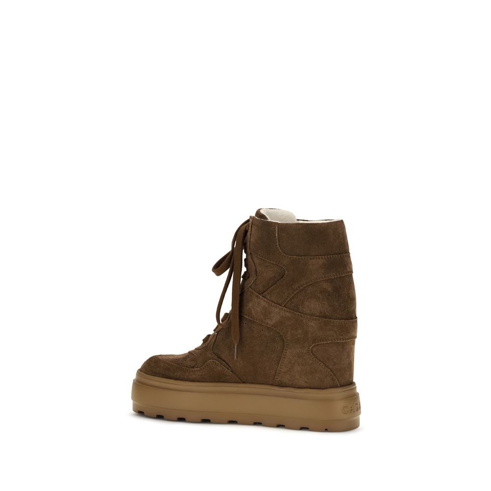 Sneakers by Casadei for women in suede calfskin leather brown presents a sumptuous silhouette, artfully capturing the essence of the Women's High Top Chunky Suede Calfskin Leather Sneakers with its sumptuous high-top chunky style design.
