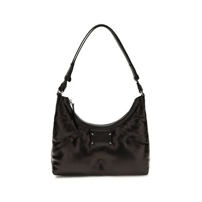 Small Quilted Shoulder Hobo Bag by Maison Margiela for women in lambskin leather black & signature showcases a enviable silhouette, artfully detailed with a secure zipper, organized , and versatile shoulder-strap for a enviable look.