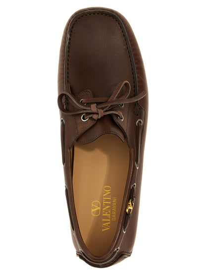 This Loafer Slip-On Lace-Up Shoes by Valentino Garavani for men in buffalo leather brown & signature features an exquisite silhouette from the V Logo Men's Buffalo Leather Loafer Slip-On Lace-Up Shoes collection, defined by a sophisticated and elegant .