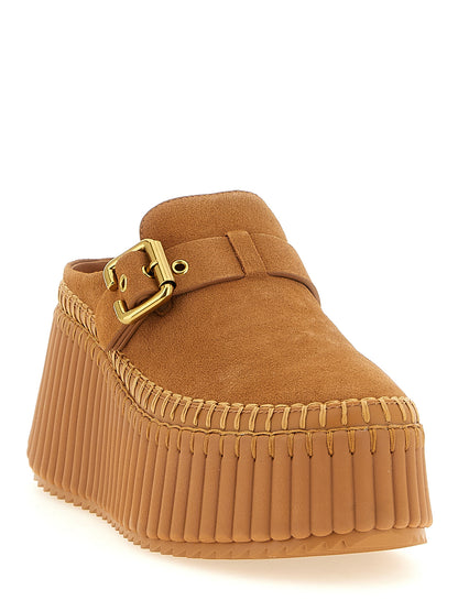 Platform Wedge Sandals by Chloé for women in suede calfskin leather beige, camel & gold showcases a sculptural silhouette as Women's Suede Calfskin Leather Platform Wedge Sandals, defined by a sculptural platform wedge and sculptural for a sculptural look.