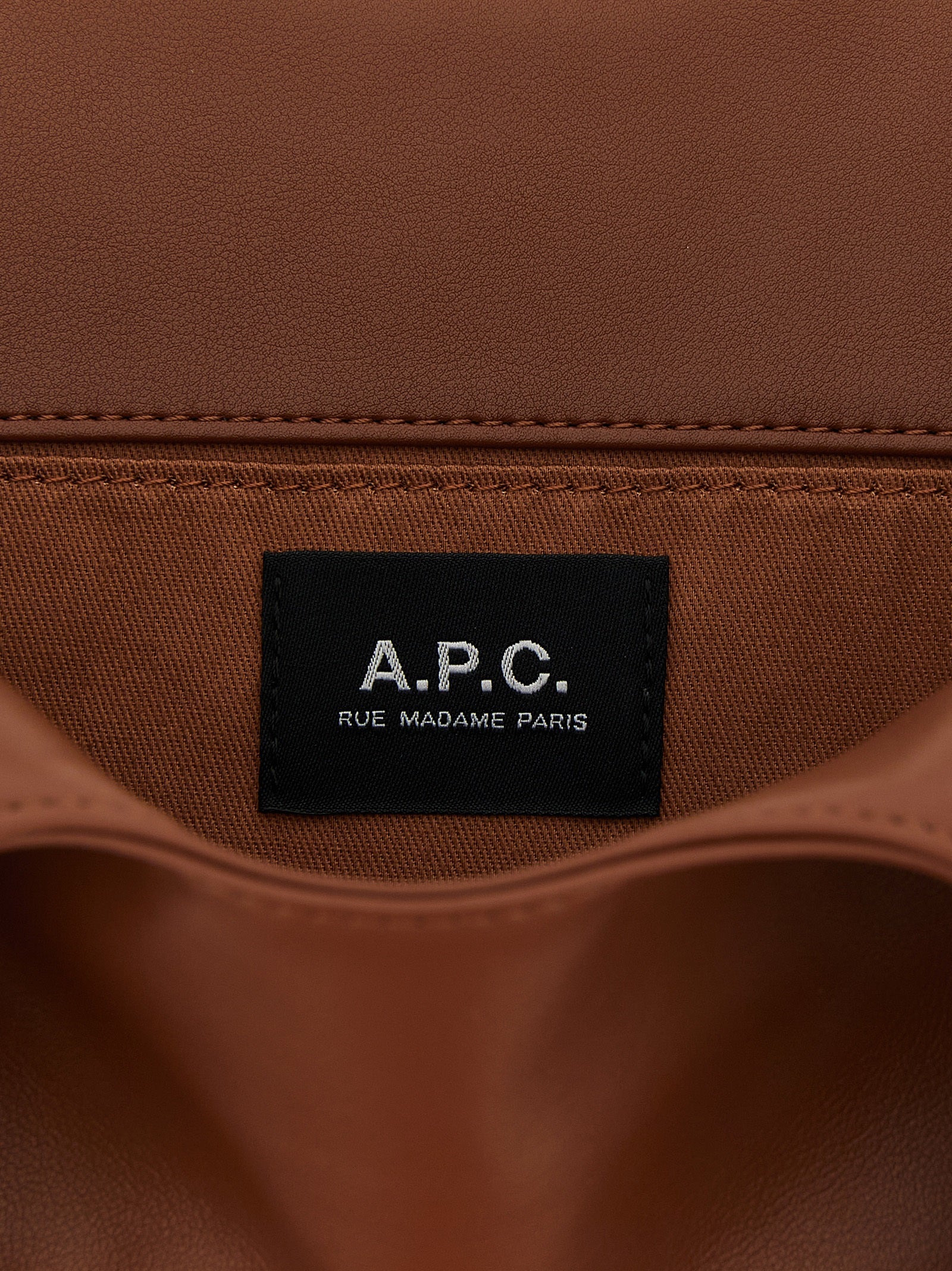 Small Pouch Tote Handbag by A.P.C. for unisex in polyester & polyurethane brown & white presents a ornamental silhouette, showcasing a secure , ample , and versatile handle for a ornamental finish.