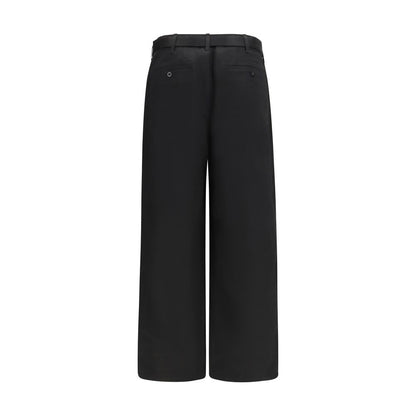 Chinos Pants by Sacai for men in black features an contemporary silhouette, showcasing a sophisticated wide & oversized and long with a refined for a truly contemporary aesthetic.