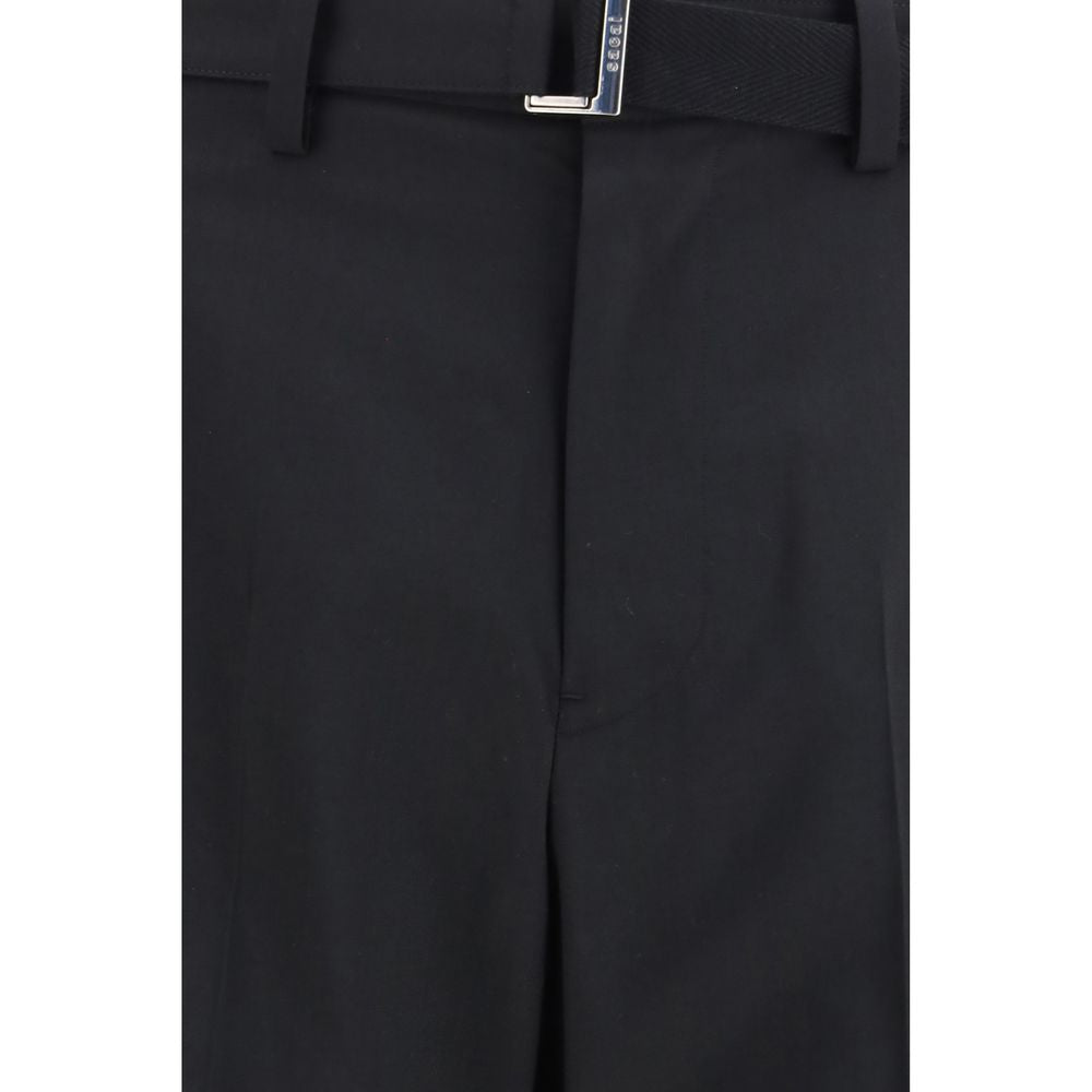 Casual Pants by Sacai for men in cupro wool & polyester black & silver presents a tailored silhouette, showcasing a tailored relaxed-fit, wide & oversized and long cut with a refined for a truly tailored aesthetic.