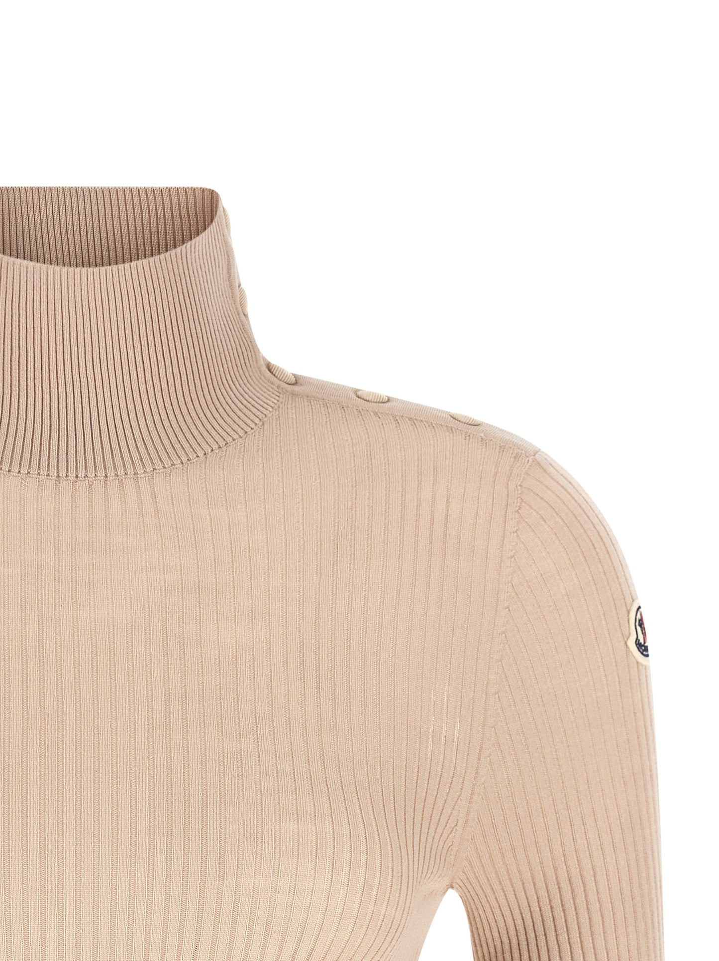 Cardigan by Moncler for women in merino virgin wool beige features a nuanced silhouette with a refined turtle neckline and nuanced detailing for a sophisticated look.