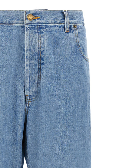 Jeans by Thom Browne for men in denim cotton gold & light-blue presents a refined pantology silhouette, artfully defined by a refined pantology straight-leg, long, and a sophisticated .