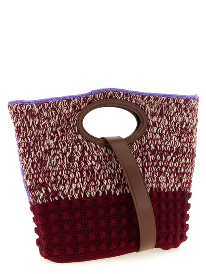 This Handbag by Marni for women in calf leather & rubber and bordeaux, brown, burgundy, cream & lilac presents a sculptural silhouette featuring a secure , ample , and versatile shoulder-strap & handle for a sculptural finish.