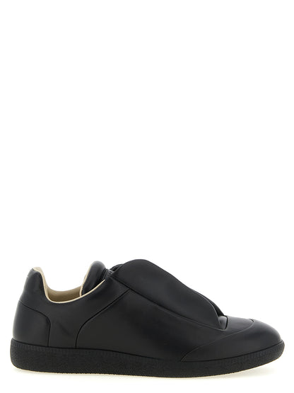 Sneakers by Maison Margiela for men in plush calfskin leather black & signature presents a impeccable silhouette as Men's Low Top Plush Calfskin Leather Sneakers, expertly defined by a impeccable low-top style for a impeccable, high-fashion look.