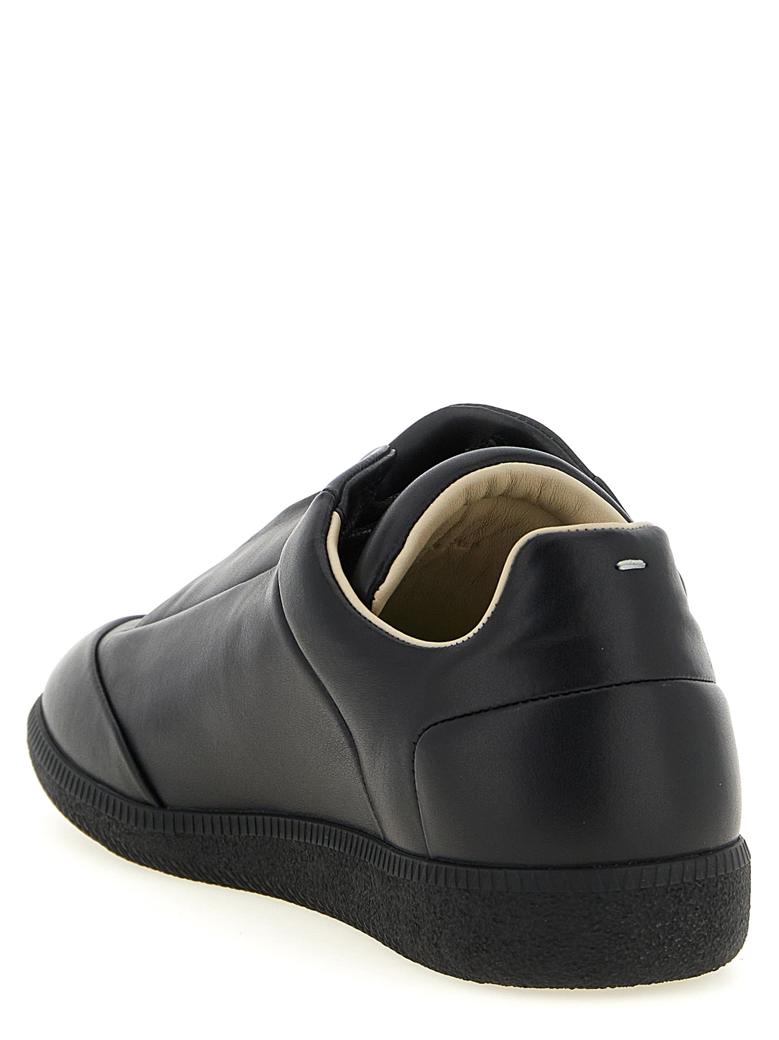 Sneakers by Maison Margiela for men in plush calfskin leather black & signature presents a impeccable silhouette as Men's Low Top Plush Calfskin Leather Sneakers, expertly defined by a impeccable low-top style for a impeccable, high-fashion look.