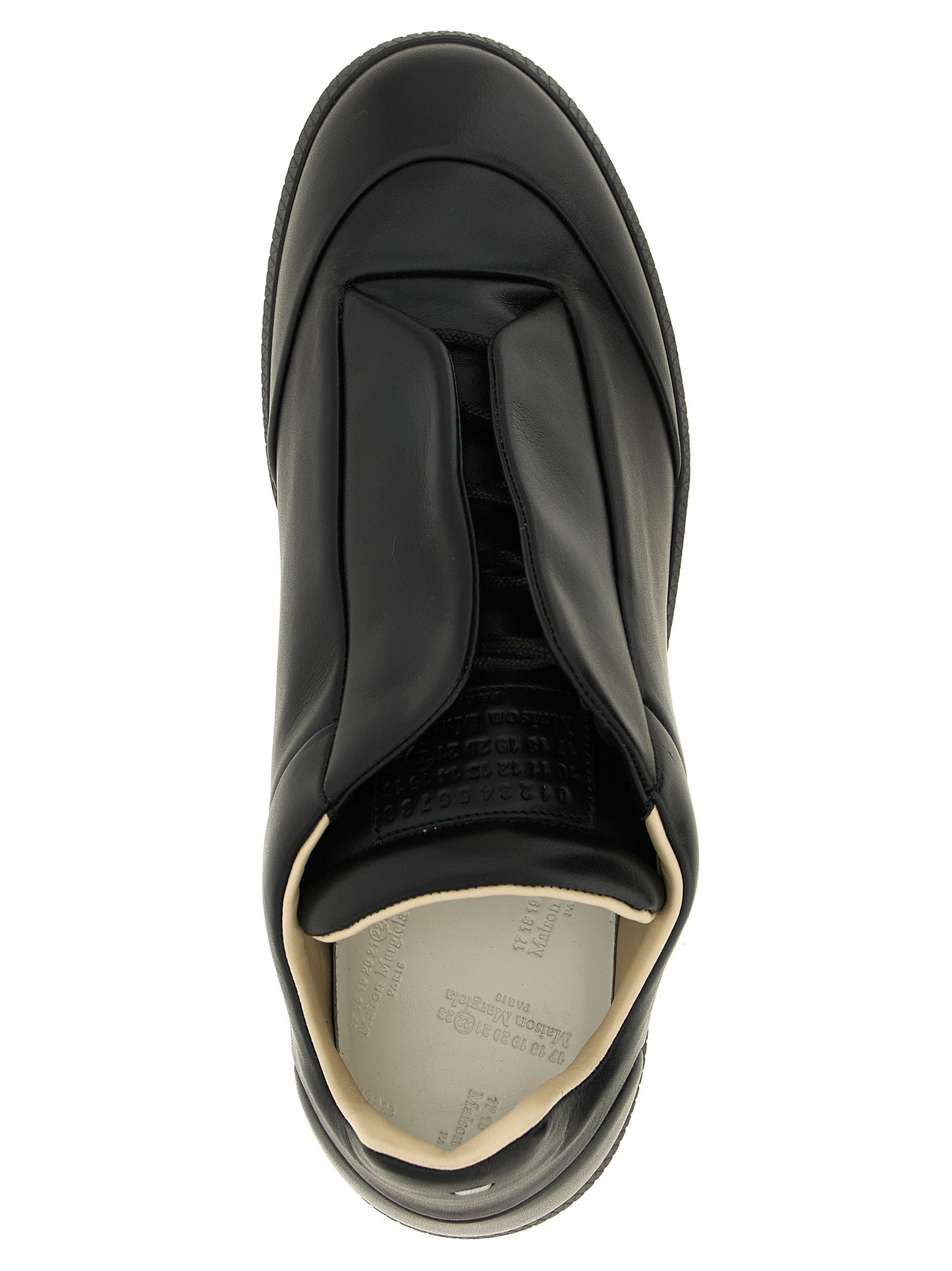 Sneakers by Maison Margiela for men in plush calfskin leather black & signature features a chic design, perfectly showcasing the chic low-top style of this Men's Low Top Plush Calfskin Leather Sneakers.