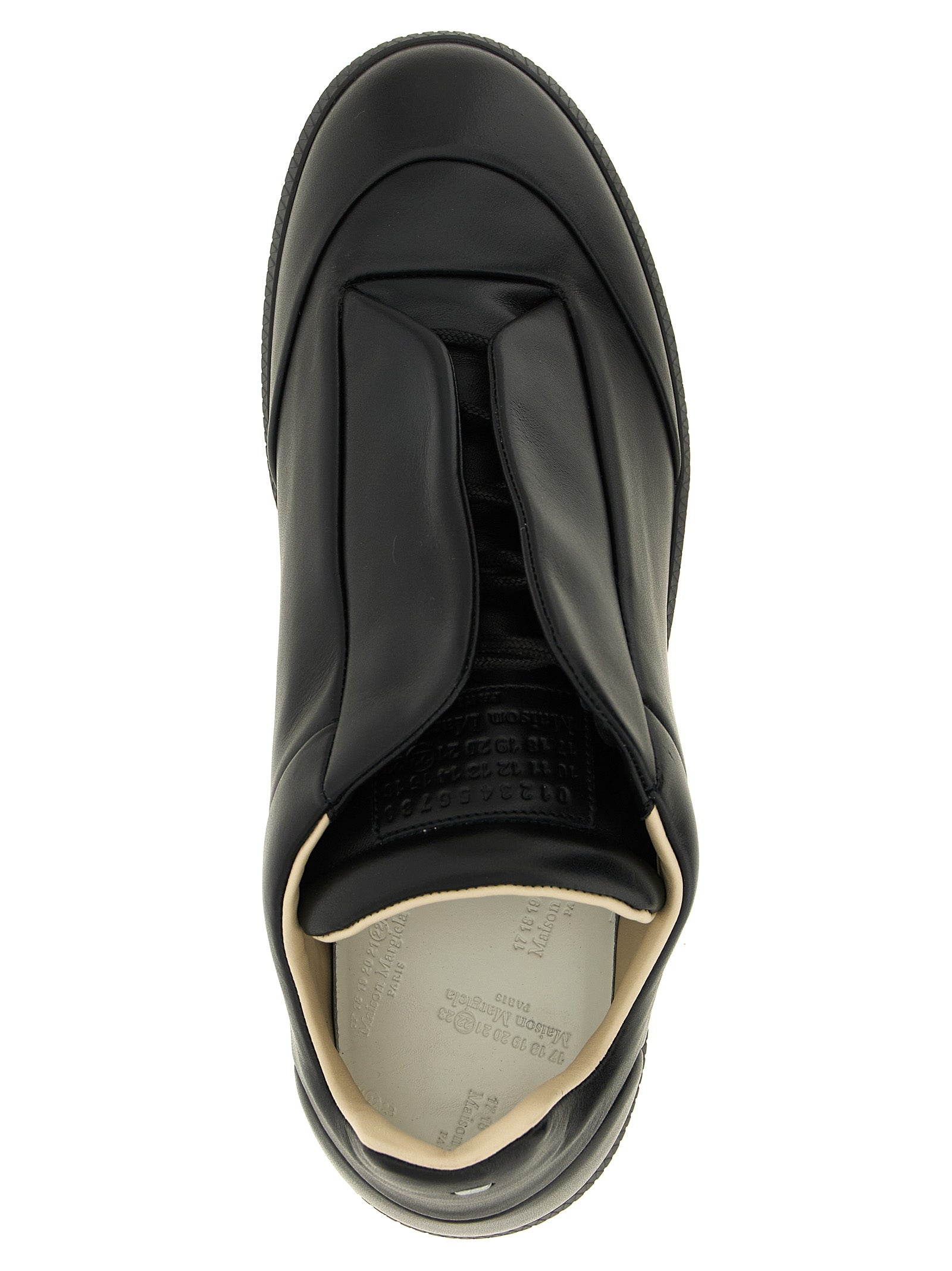 Sneakers by Maison Margiela for men in plush calfskin leather black & signature features a chic design, perfectly showcasing the chic low-top style of this Men's Low Top Plush Calfskin Leather Sneakers.