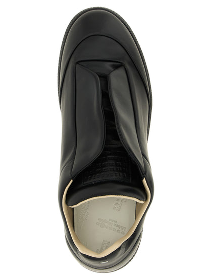 Sneakers by Maison Margiela for men in plush calfskin leather black & signature features a chic design, perfectly showcasing the chic low-top style of this Men's Low Top Plush Calfskin Leather Sneakers.