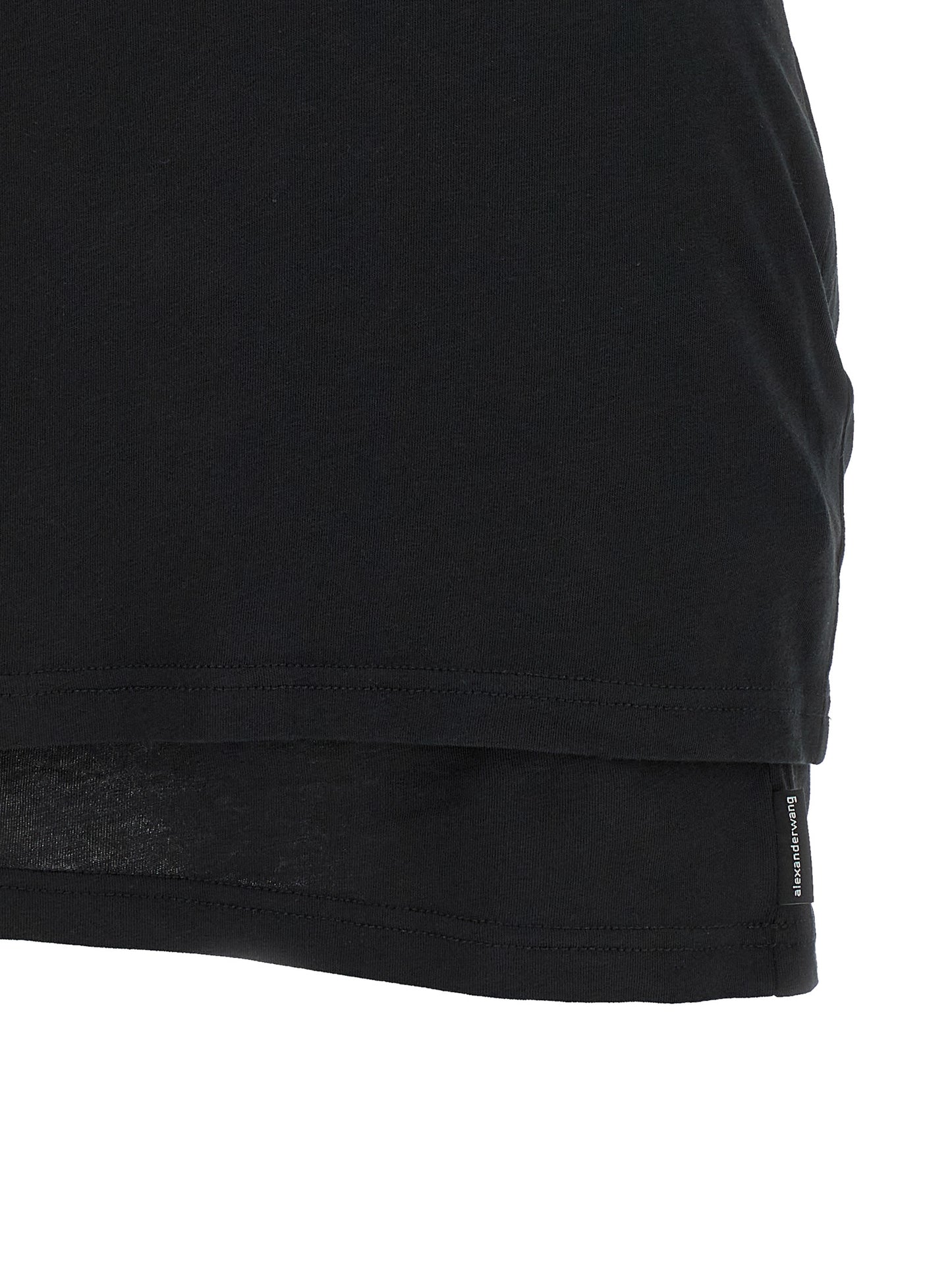 Dress by Alexander Wang for women in stretch cotton black features a dramatic silhouette, showcasing an elegant and that flows into a dramatic short.