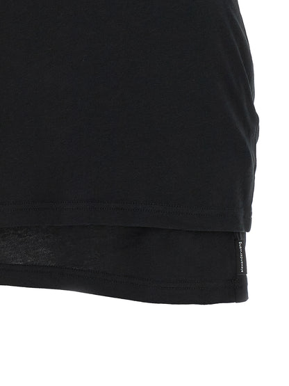 Dress by Alexander Wang for women in stretch cotton black features a dramatic silhouette, showcasing an elegant and that flows into a dramatic short.