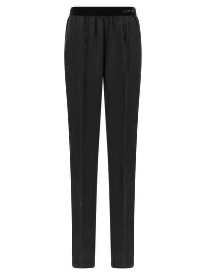 Pajamas by Tom Ford for women in silk black features an ethereal silhouette, artfully capturing the ethereal aesthetic of Women's Silk Pajamas with a focus on refined comfort.