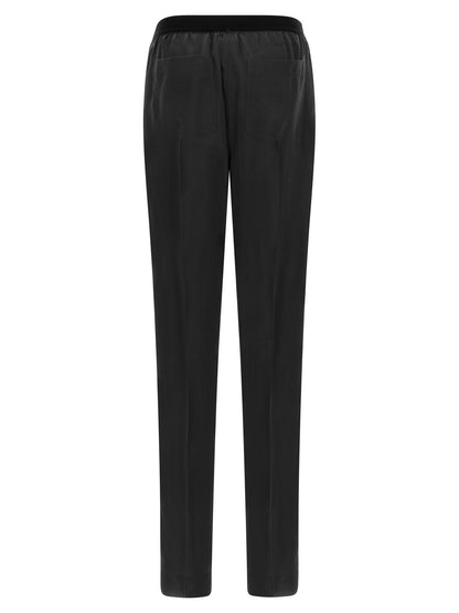 This Pajamas by Tom Ford for women in silk black features an encompassing silhouette, showcasing the refined craftsmanship of the Women's Silk Pajamas collection with an encompassing finish.