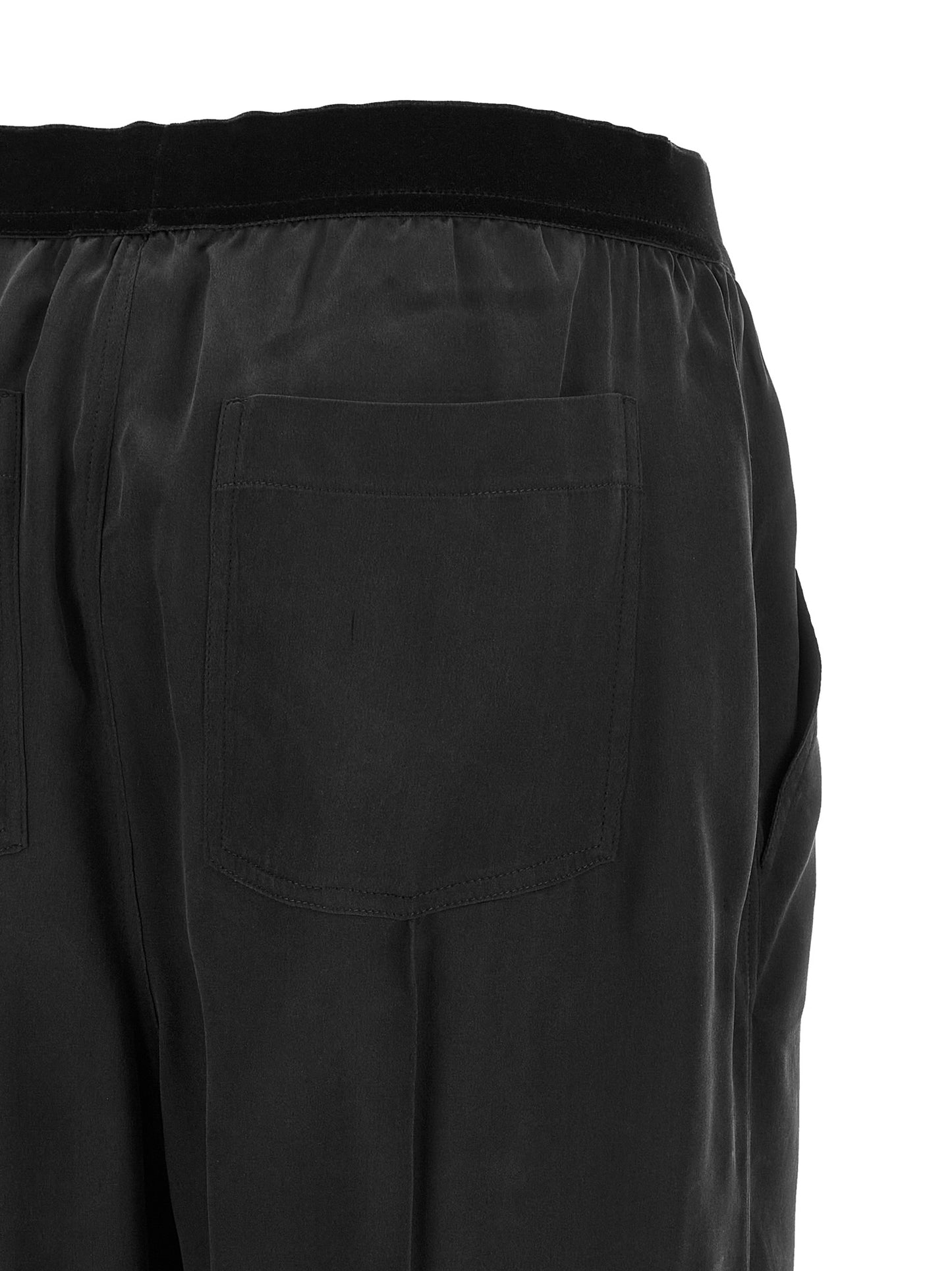 Pajamas by Tom Ford for women in silk black features a avant-garde silhouette, artfully capturing the essence of the avant-garde Women's Silk Pajamas design for a sophisticated and relaxed look.