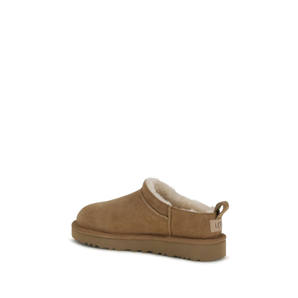 Mules Flat Shoes by UGG for women in eva polyester suede leather brown & signature features an captivating silhouette, showcasing the captivating style of the Women's EVA Polyester Suede Leather Mules Flat Shoes with its distinct and refined .