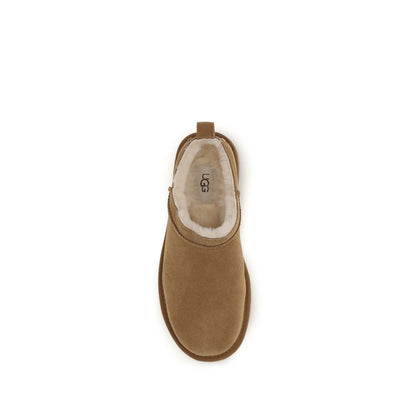 Mules Flat Shoes by UGG for women in eva polyester suede leather brown & signature presents a effortless chic silhouette, showcasing the Women's EVA Polyester Suede Leather Mules Flat Shoes design with a effortless chic and for a sophisticated look.