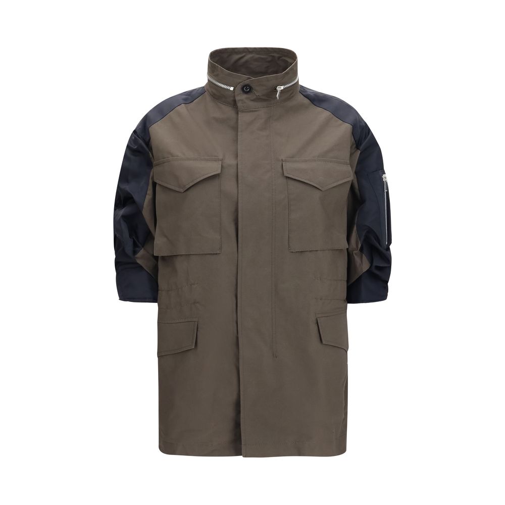 Windbreaker Jacket by Sacai for women in nylon cotton bicolour features an perennial silhouette with a refined high-collar neckline and perennial pockets & windproof for a sophisticated weather-resistant look.