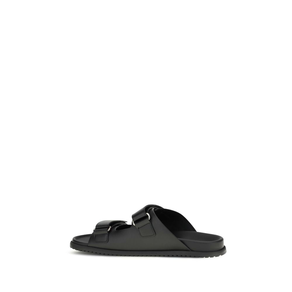 Flat Sandals by Dolce & Gabbana for men in eva polyurethane & bos taurus calfskin leather black & signature features an effortlessly chic silhouette from the Men's EVA Polyurethane & Bos Taurus Calfskin Leather Flat Sandals collection, showcasing a effortlessly chic flat and elegant .