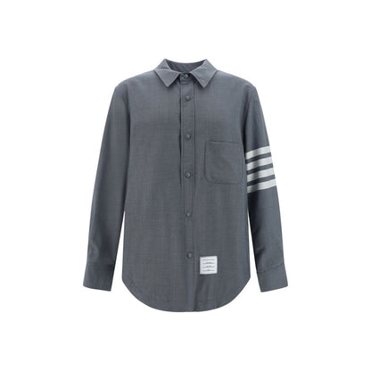 Dress Shirt by Thom Browne for men in wool cotton gray, signature & striped showcases a sublime silhouette, artfully detailed with a sublime and long-sleeve for a sophisticated, sublime finish.