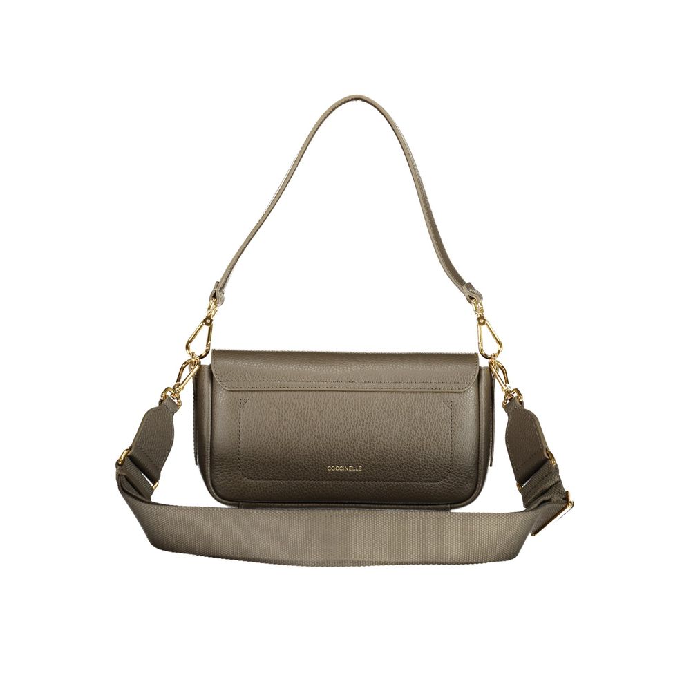 Handbag by Coccinelle for women in leather brown & signature features a ornamental silhouette, showcasing a secure zipper, ample external-pockets, and ornamental shoulder-strap & adjustable-strap for a sophisticated look.