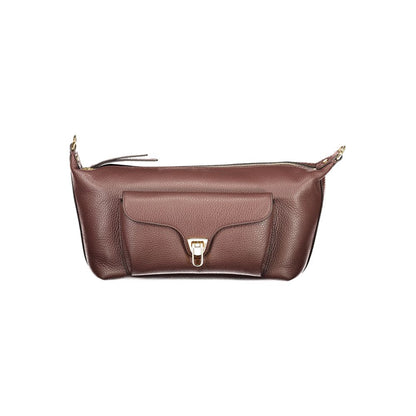 Handbag by Coccinelle for women in leather brown features a exquisite silhouette, showcasing a secure zipper and exquisite external-pockets & internal-pockets with versatile shoulder-strap & adjustable-strap for a exquisite finish.